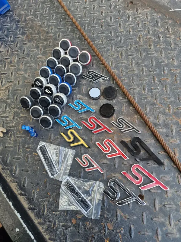ST badges, knobs, and decals on the workshop floor