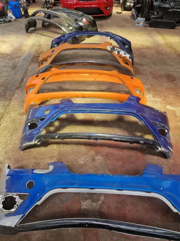 Row of salvaged front bumpers