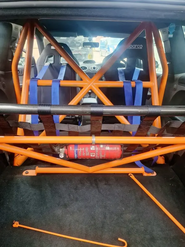Orange roll cage interior with Sparco seats